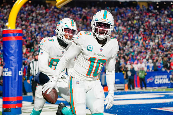 Miami Dolphins wide receiver Tyreek Hill (10) reacts to scoring a touchdown against the Buffalo Bills during the second half at Highmark Stadium.
